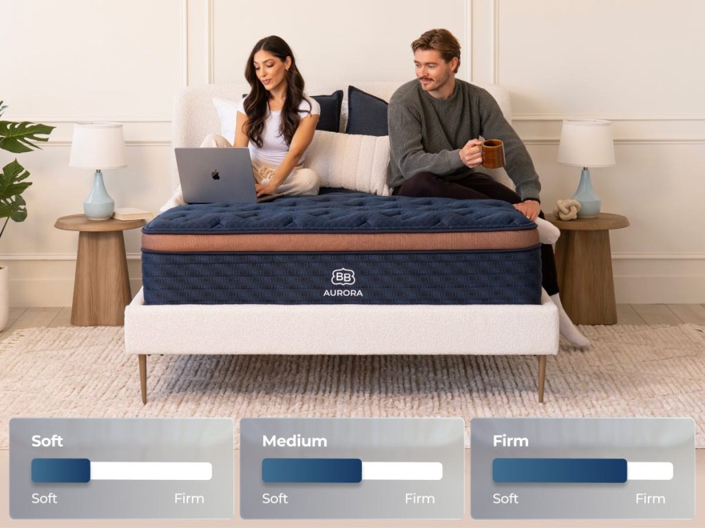 Couple sitting on the Aurora Luxe with soft, medium and firm labels