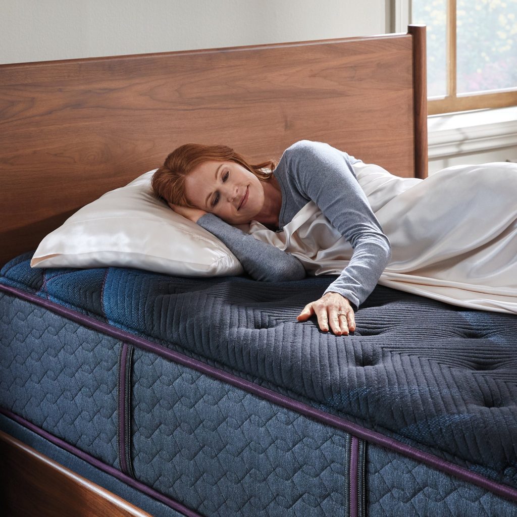 Woman lying on a Beautyrest World Class Level Three mattress