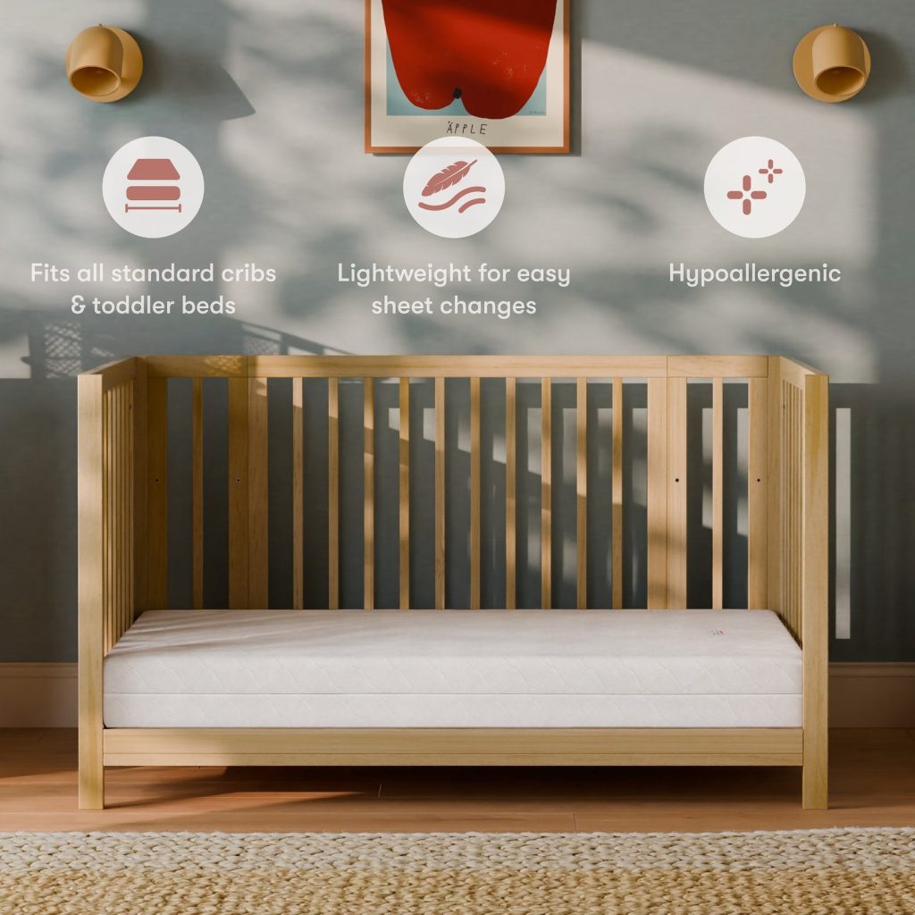 Babyletto Pure Core mattress in a wooden crib in a nursery