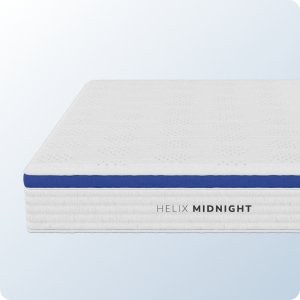 Corner of the Helix Midnight mattress with its blue border band