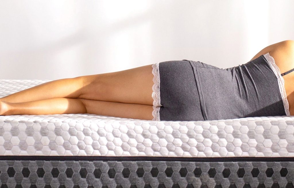 Woman lying on her side on the Layla Memory Foam Mattress