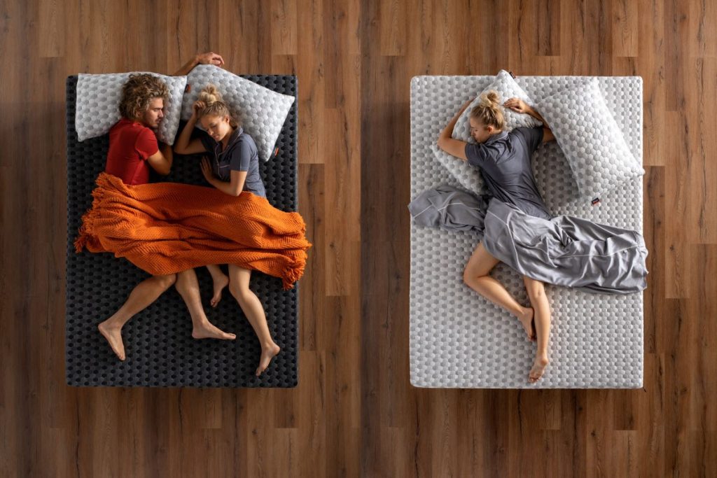 Overhead view of people sleeping on the firm and soft sides of the Layla Memory Foam Mattress