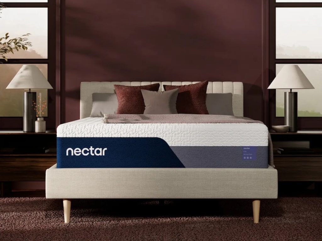 Nectar Luxe Memory Foam mattress, front view on an upholstered bed