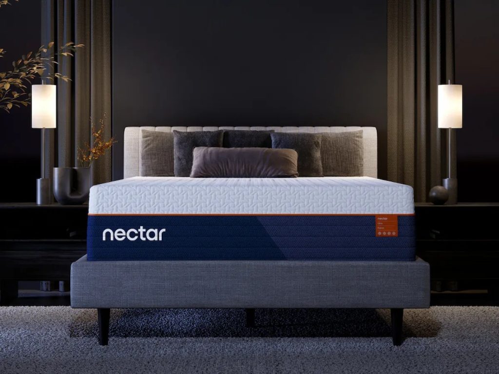 Nectar Ultra Hybrid mattress seen from the foot of the bed in a dark bedroom