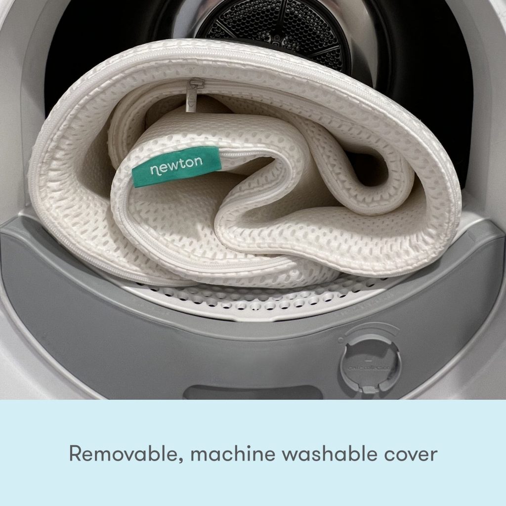 Rolled Newton Essential mattress cover in a washing machine drum