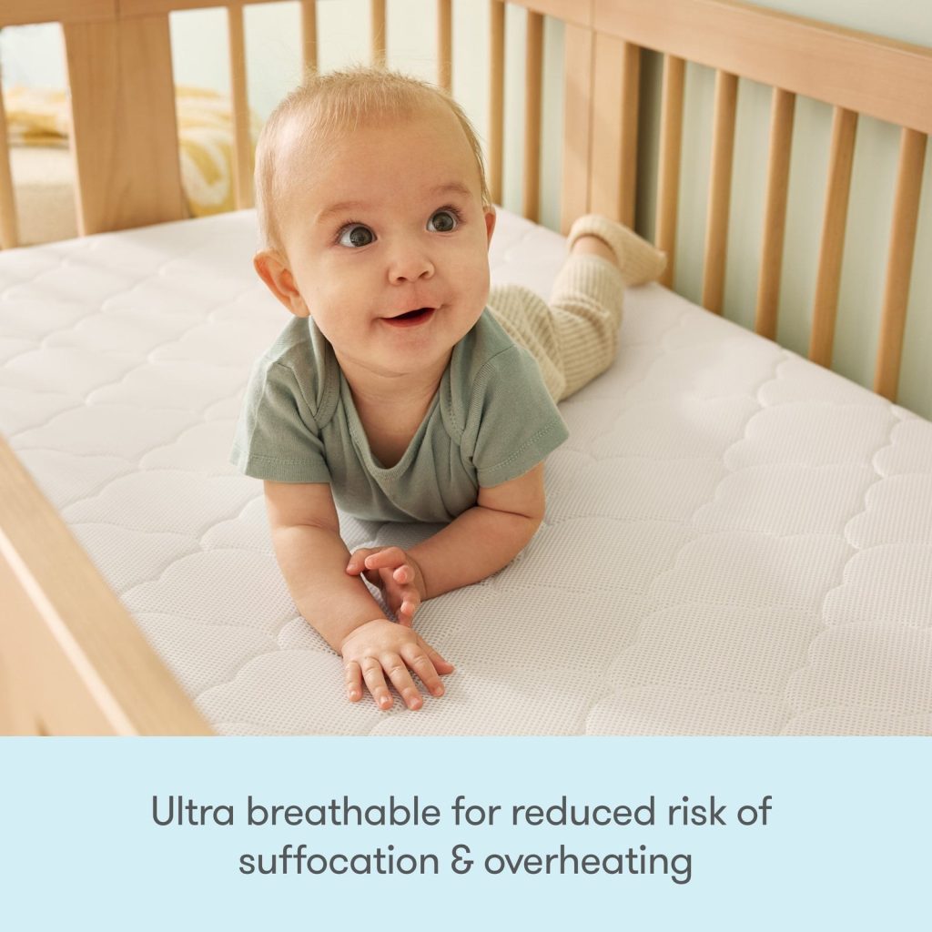 Baby lying on the quilted cover of the Newton Original crib mattress