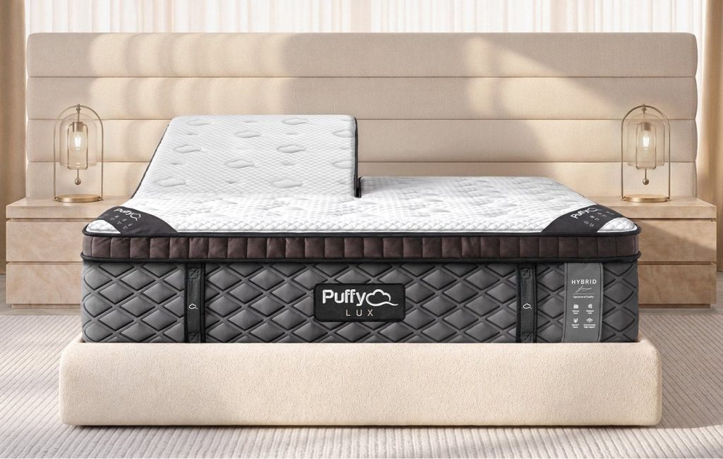 Puffy Lux Hybrid Mattress with the head raised on an adjustable base