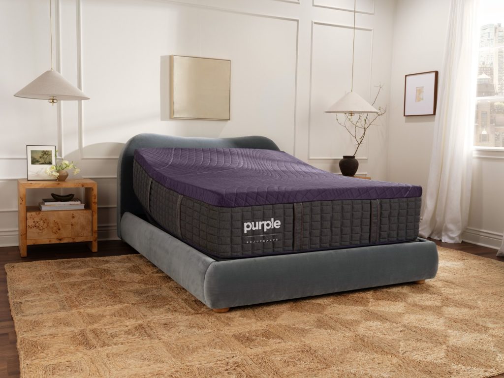 Purple Rejuvenate on a smart adjustable base in a bright paneled bedroom