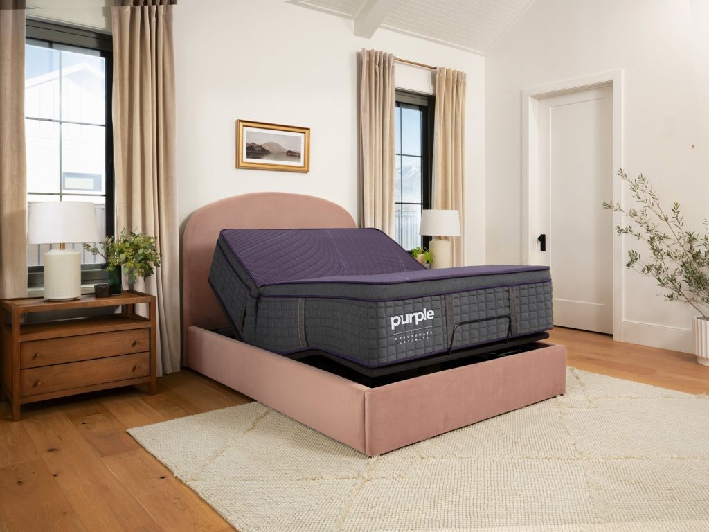 Purple RejuvenateUltimate on a raised adjustable base in a bright bedroom