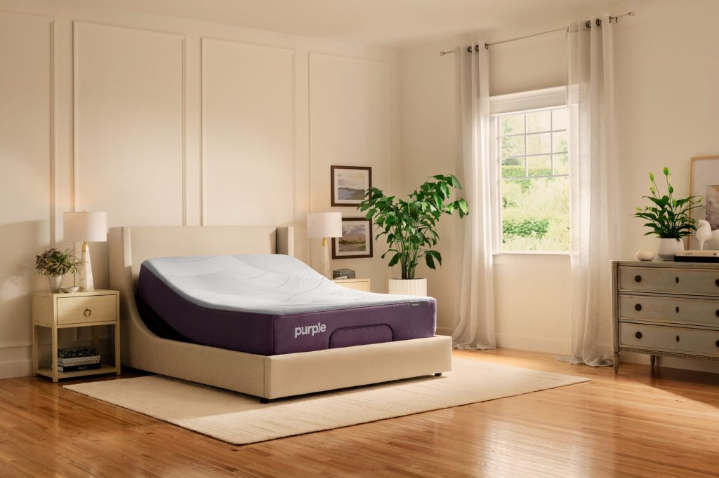 Purple Restore Hybrid on a smart adjustable base in a bright bedroom