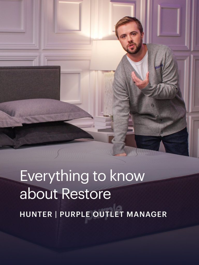Purple staff member presenting the Restore Hybrid in a video still