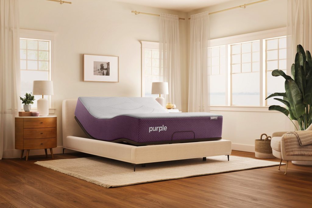 Purple RestorePlus Hybrid on a smart adjustable base in a sunny bedroom