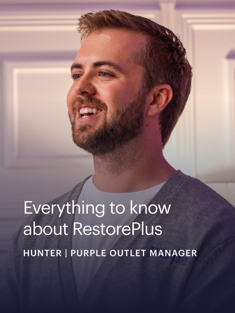 Purple staff member smiling in a video still about the RestorePlus Hybrid