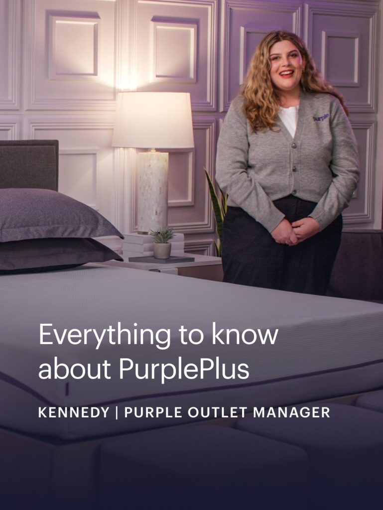 Purple staff member presenting the PurplePlus Mattress in a video still