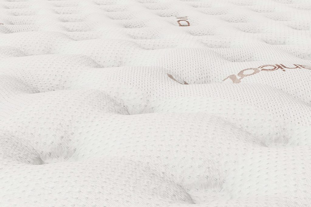 Close-up of the quilted cover of the Saatva Memory Foam Hybrid