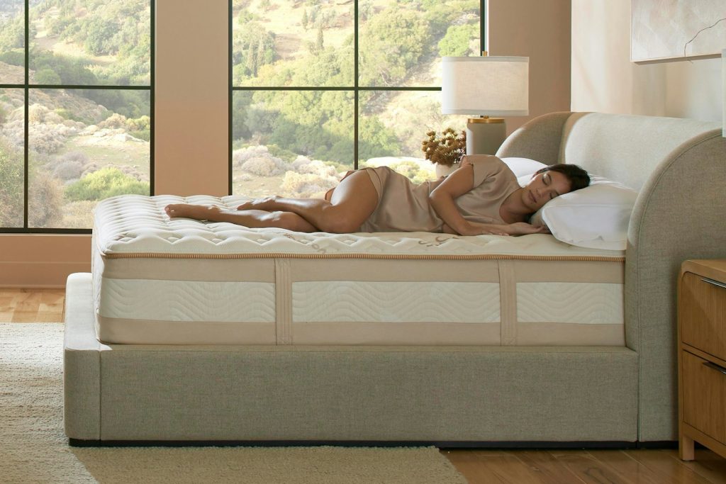 Person lying on the Saatva Rx mattress