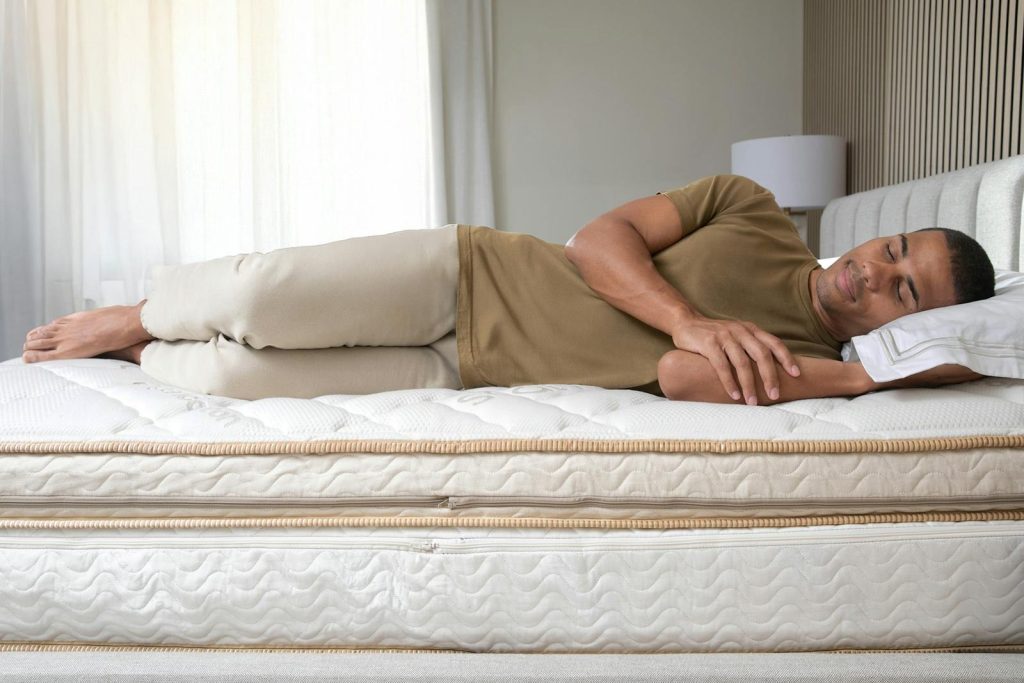 Man lying on his side on the Saatva Solaire