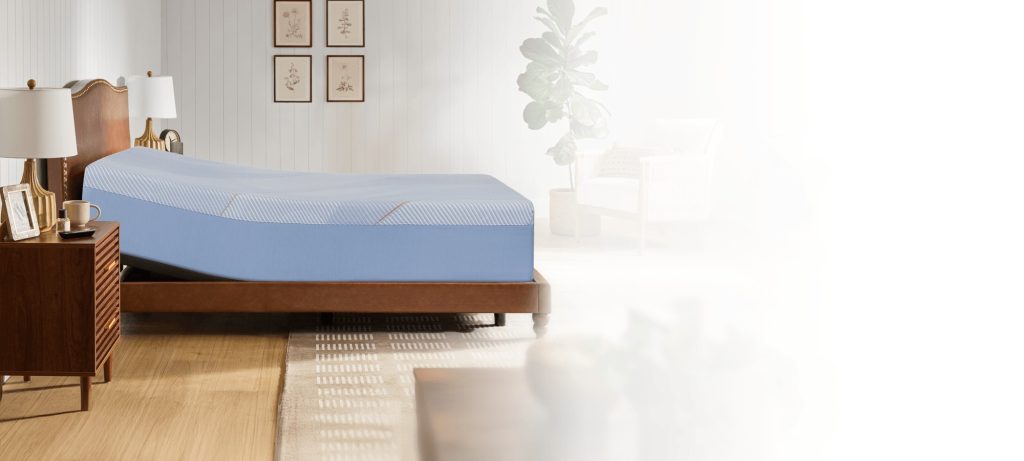 Sealy Posturepedic Hybrid on a raised adjustable base in a bedroom