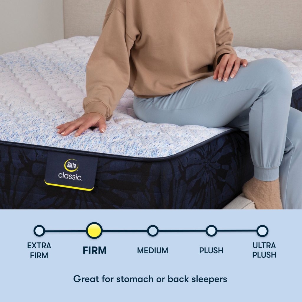 Woman sitting on a Serta Classic firm mattress