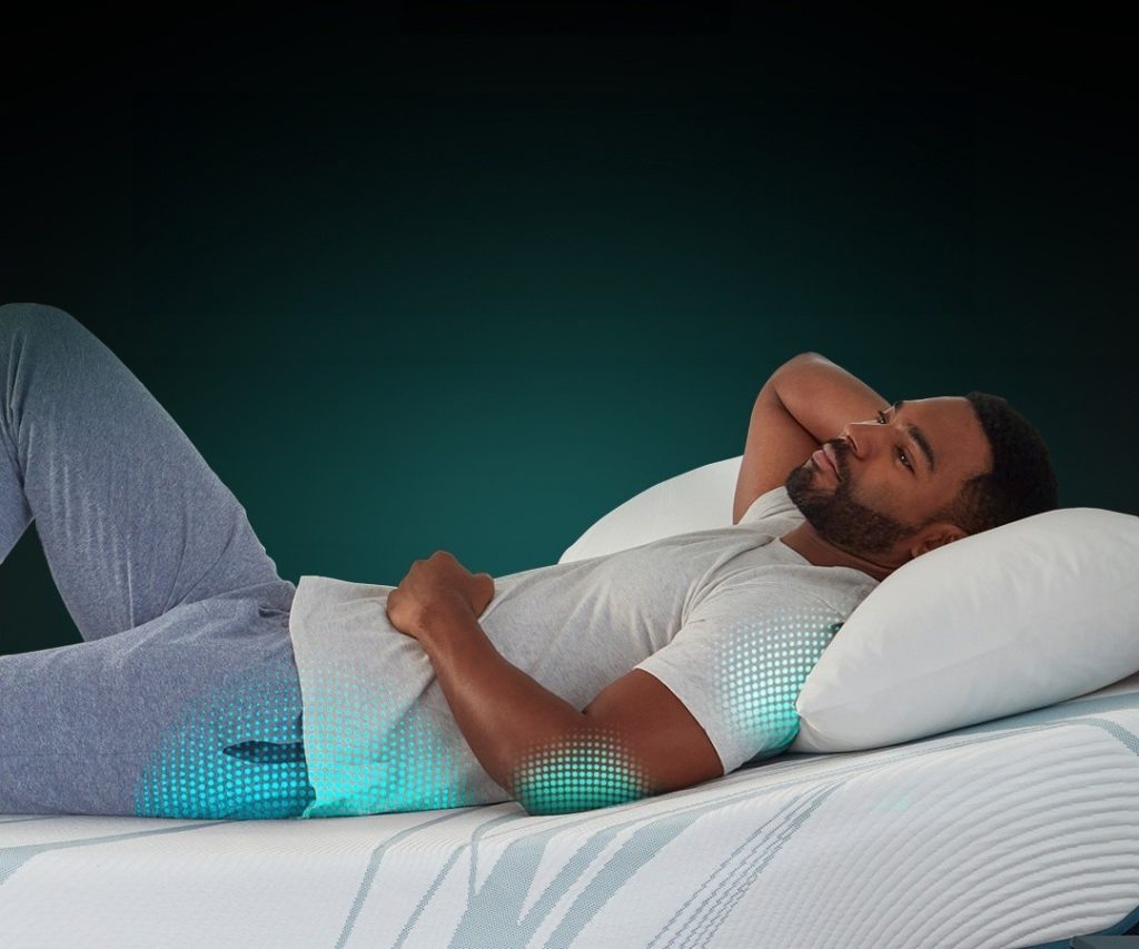 Man lying on his back on a TEMPUR-Adapt mattress