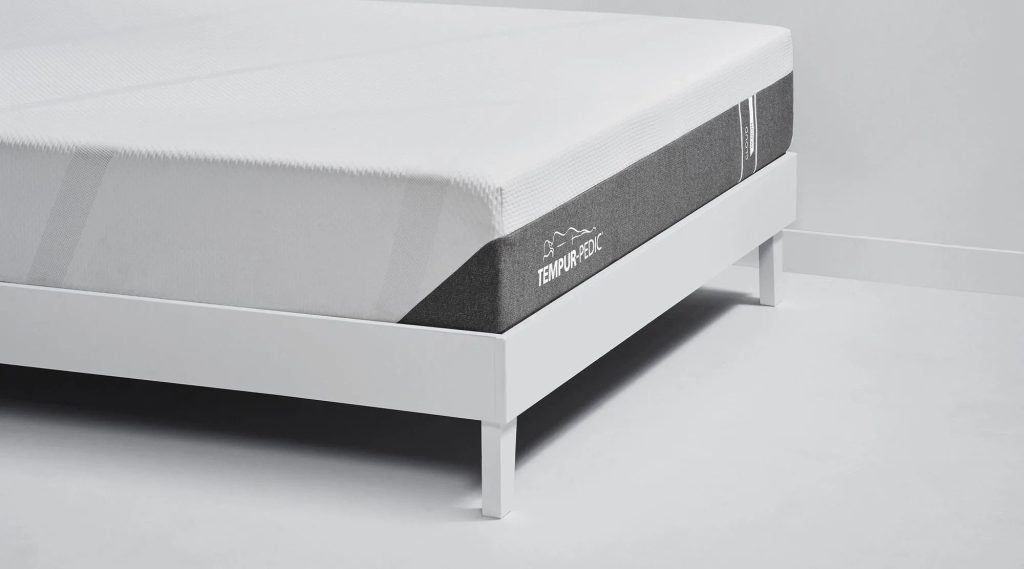 Corner of the TEMPUR-Cloud mattress on a white platform frame
